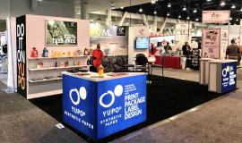 RENTAL: Gravitee Inline Design with Storage Closet with Locking Door, Bump-Out, Large Monitor Mount, 43" Monitor, (3) White Laminated Shelves, (2) LED Arm Lights, Custom Mounting for Client&acirc;��s Lightbox, (2) RE-1572 Backlit L-Shape Counters, RE-704 Chargi