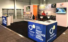 RENTAL: Gravitee Inline Design with Storage Closet with Locking Door, Bump-Out, Large Monitor Mount, 43" Monitor, (3) White Laminated Shelves, (2) LED Arm Lights, Custom Mounting for Client&acirc;��s Lightbox, (2) RE-1572 Backlit L-Shape Counters, RE-704 Chargi